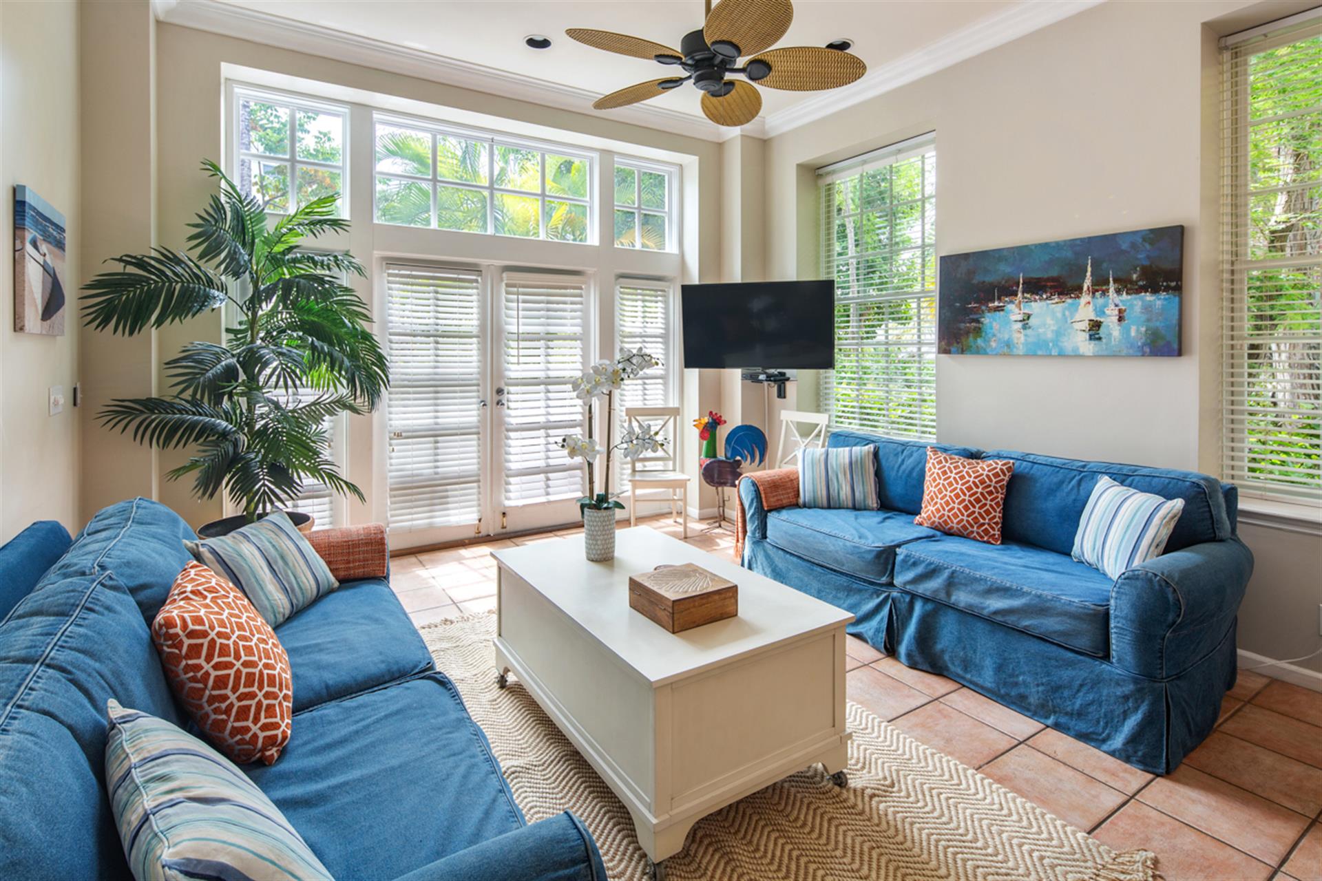Living area includes comfy seating an large HDTV.
