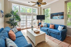 Living area includes comfy seating an large HDTV.