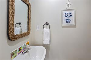 Downstairs powder room just off the kitchen. Keep calm...