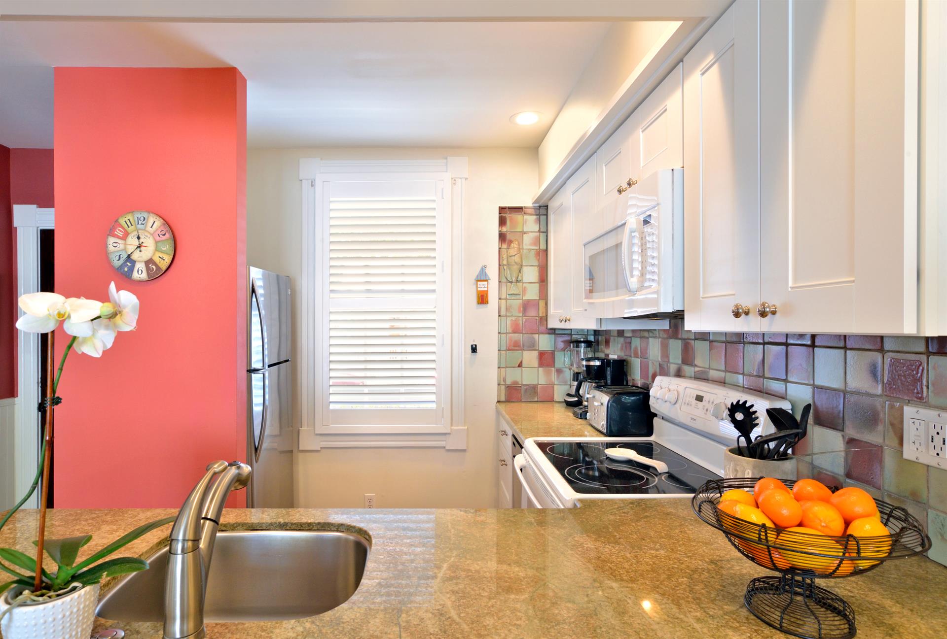 Updated kitchen with granite countertops.