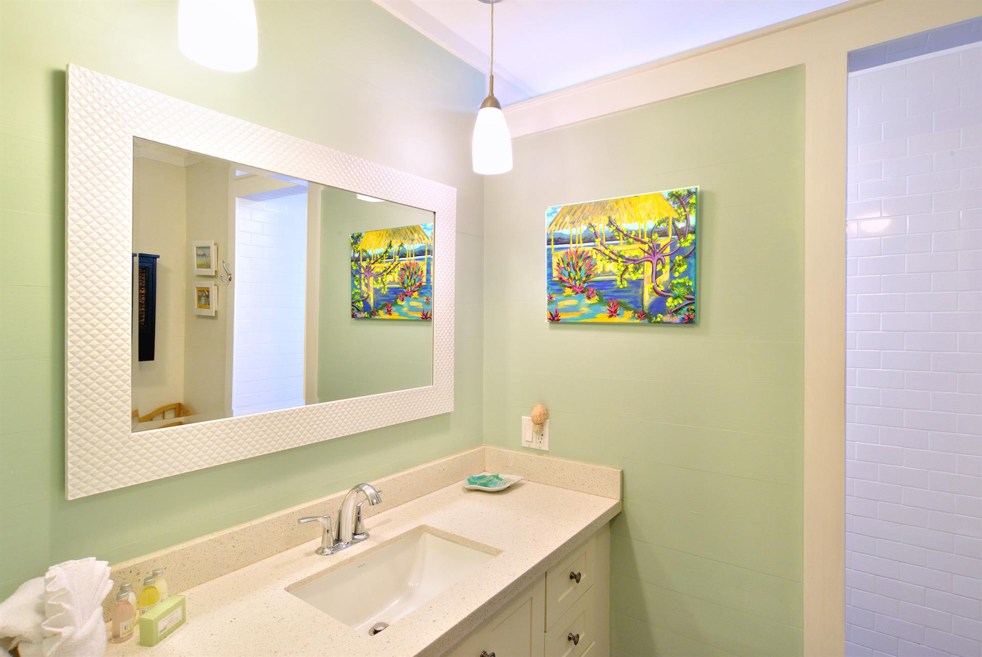 Downstairs full bathroom includes granite vanity.