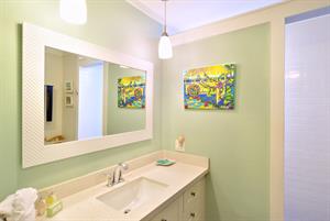 Downstairs full bathroom includes granite vanity.