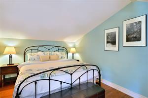 Primary bedroom offers comfortable king sized bed.