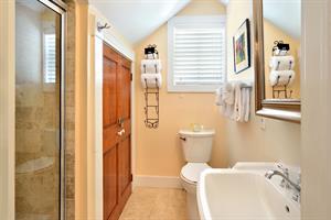 Upstairs primary bathroom with walkin shower.