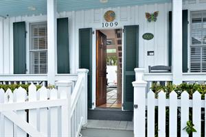 Enter Potters Cottage thru the charming white picket fence.