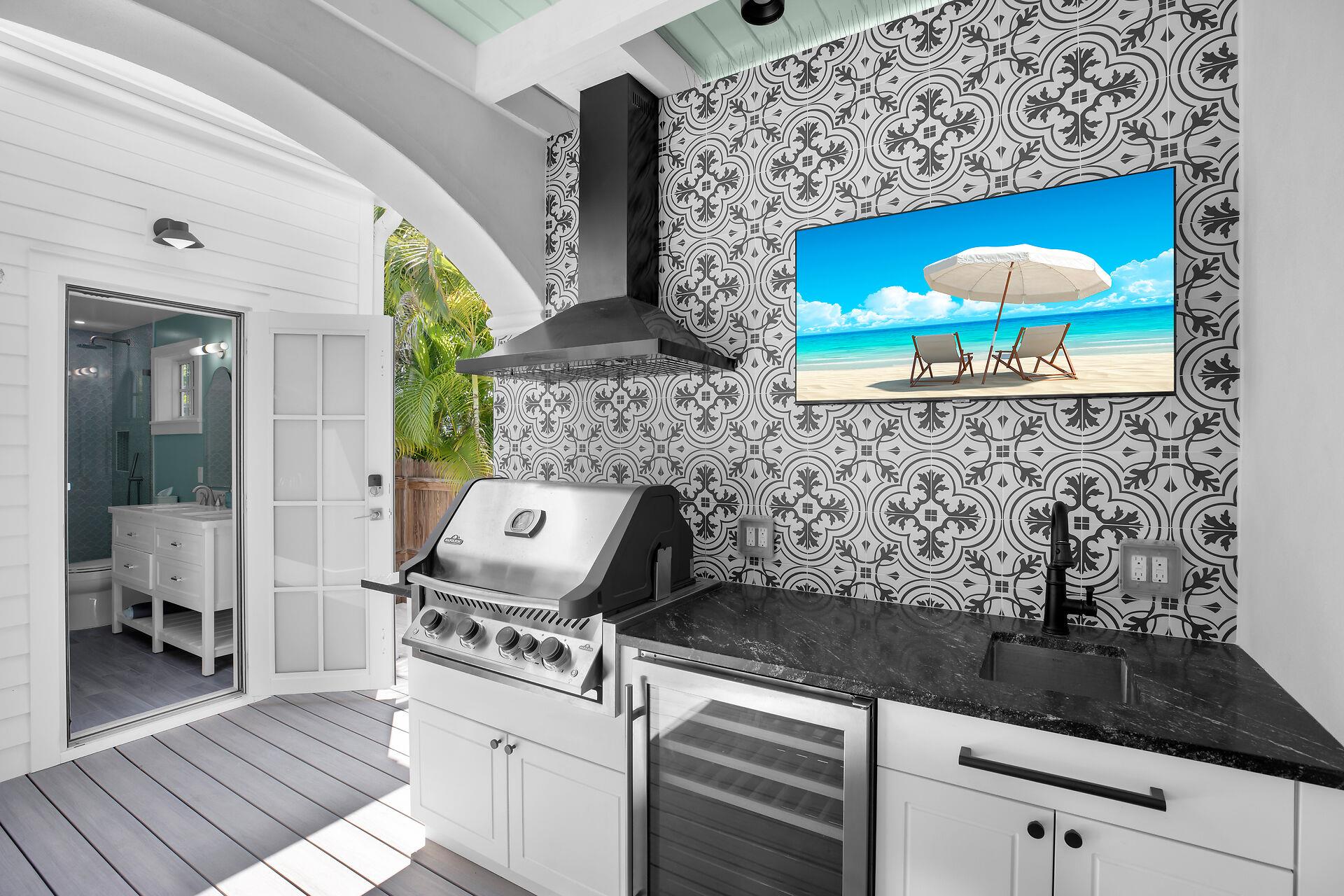 Full outdoor kitchen ,TV, and cottage bath access as well