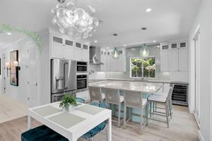 Stainless appliances and wine chiller.