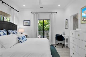 Primary has dresser, desk, and access to your private deck