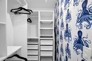 Make yourself at home in this spacious walkin closet