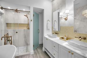 What an exquisite primary bath with tub and walk in shower.