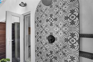 Prmary bedroom leads to your private outdoor shower.