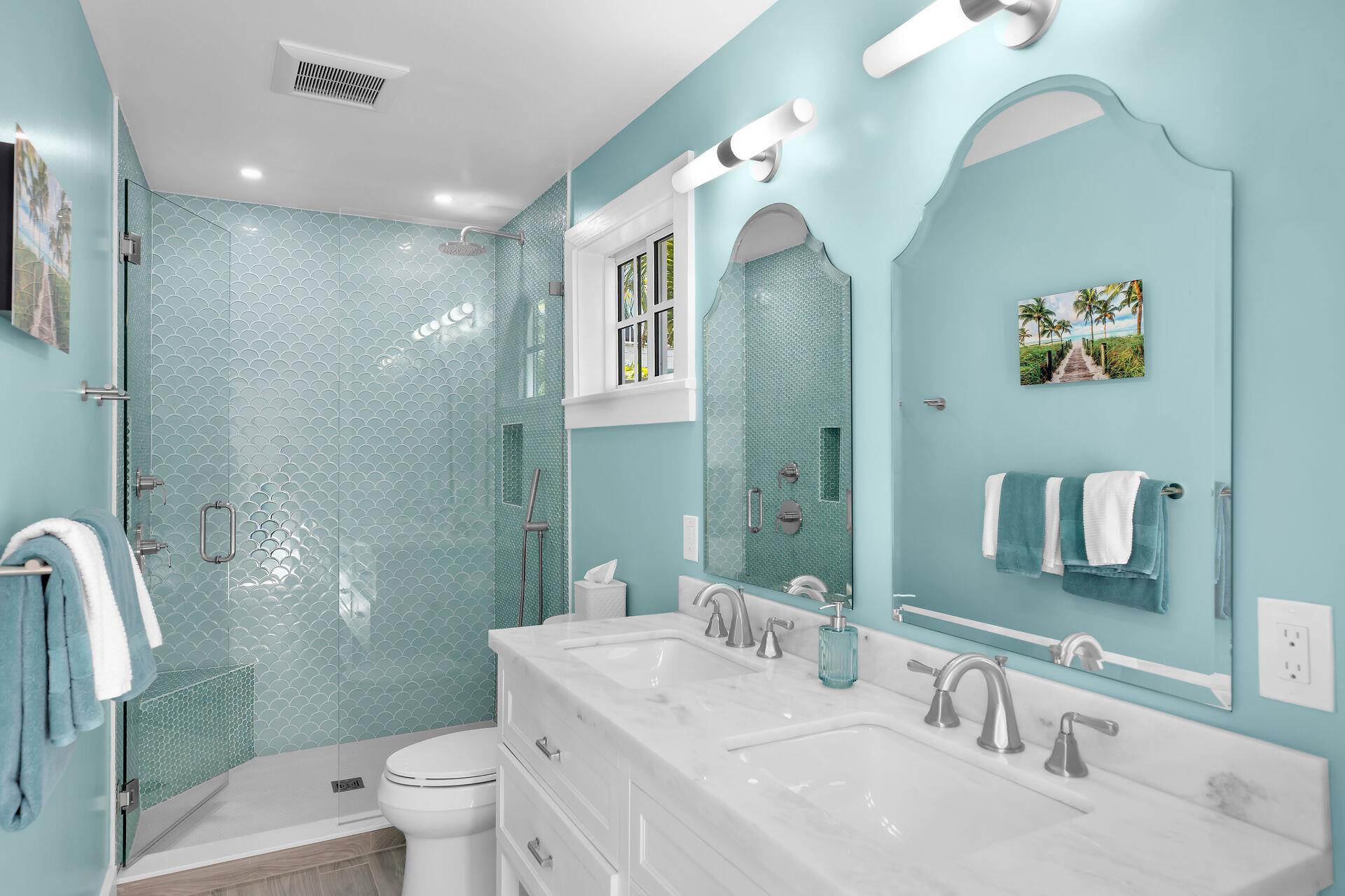 Cottage bath with double sinks and walk in shower