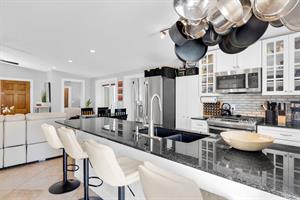 Kitchen island with sink and seating