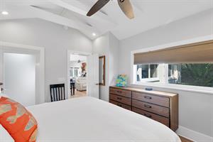 Primary king with ceiling fan and natural light