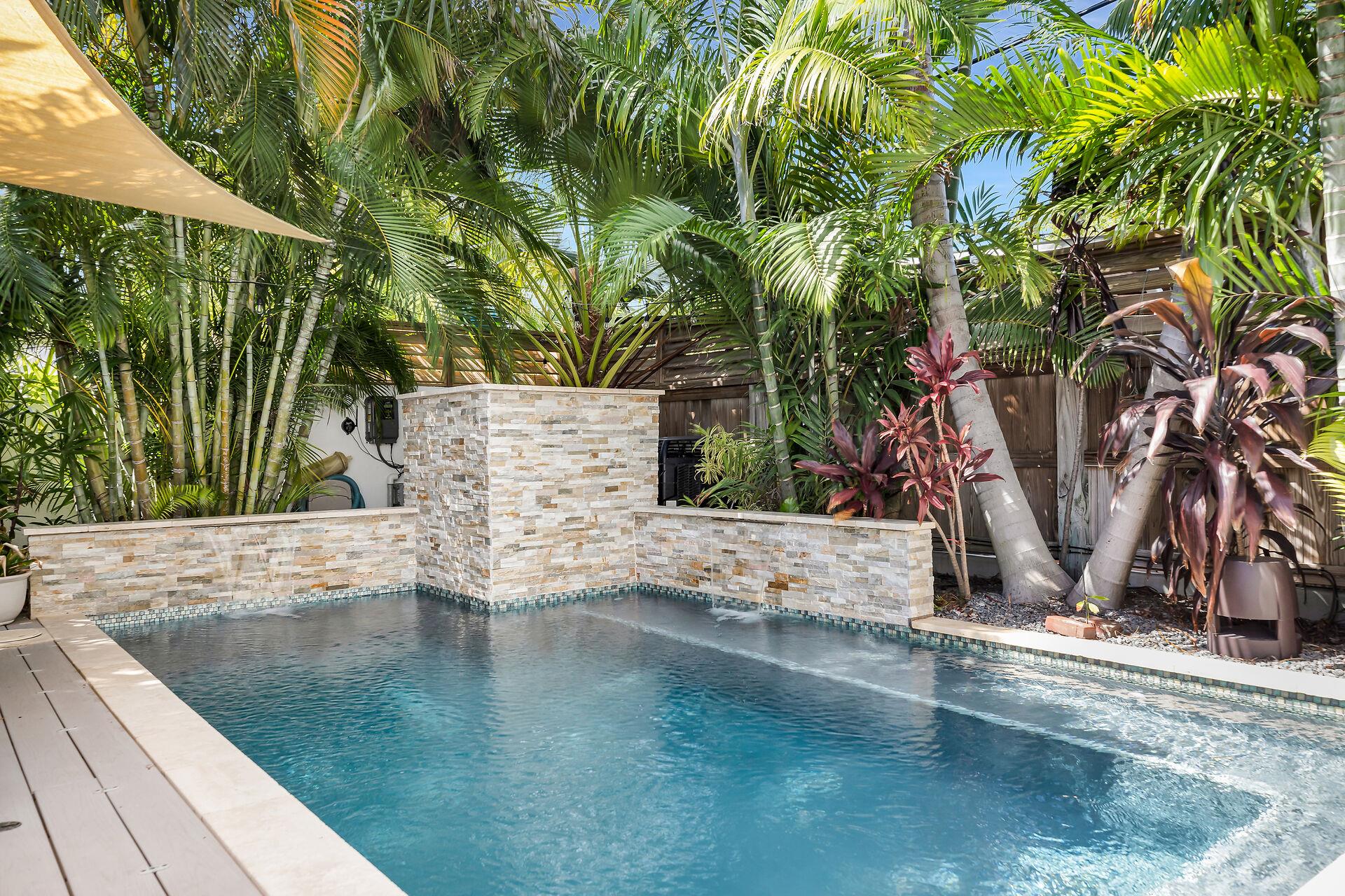 The pool has spa features including waterfall and jets