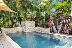 The pool has spa features including waterfall and jets