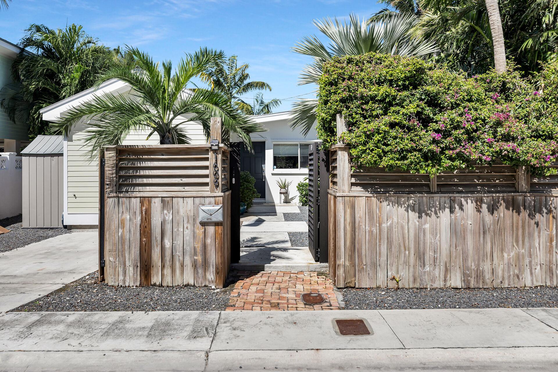 Private front area with parking.