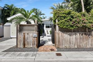 Private front area with parking.