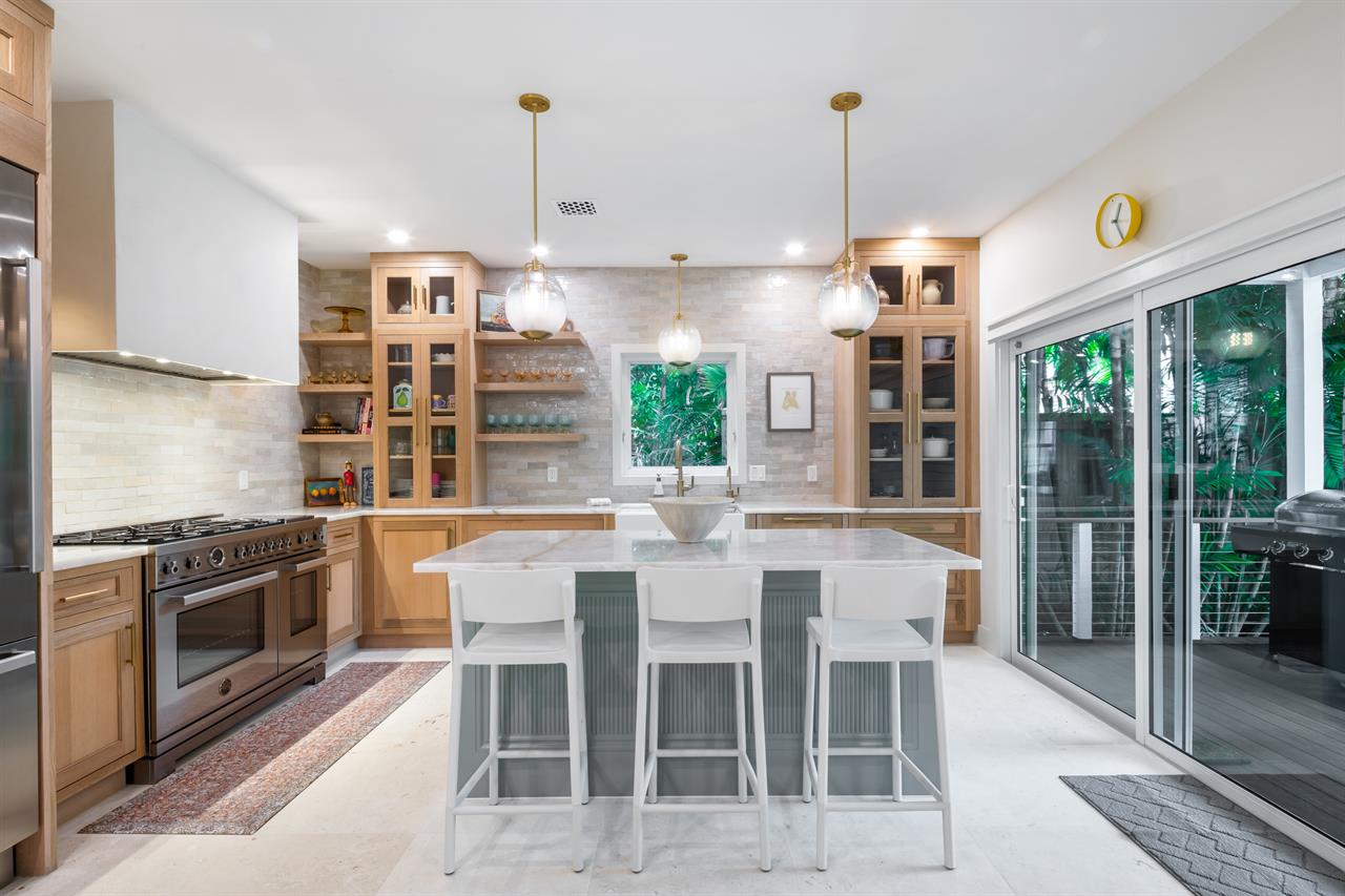 Chefs kitchen with seating at the island.