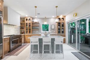 Chefs kitchen with seating at the island.