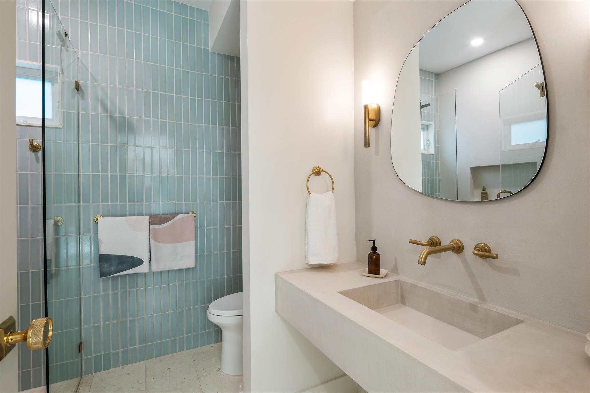 Pristine first floor bath with walkin glass shower.