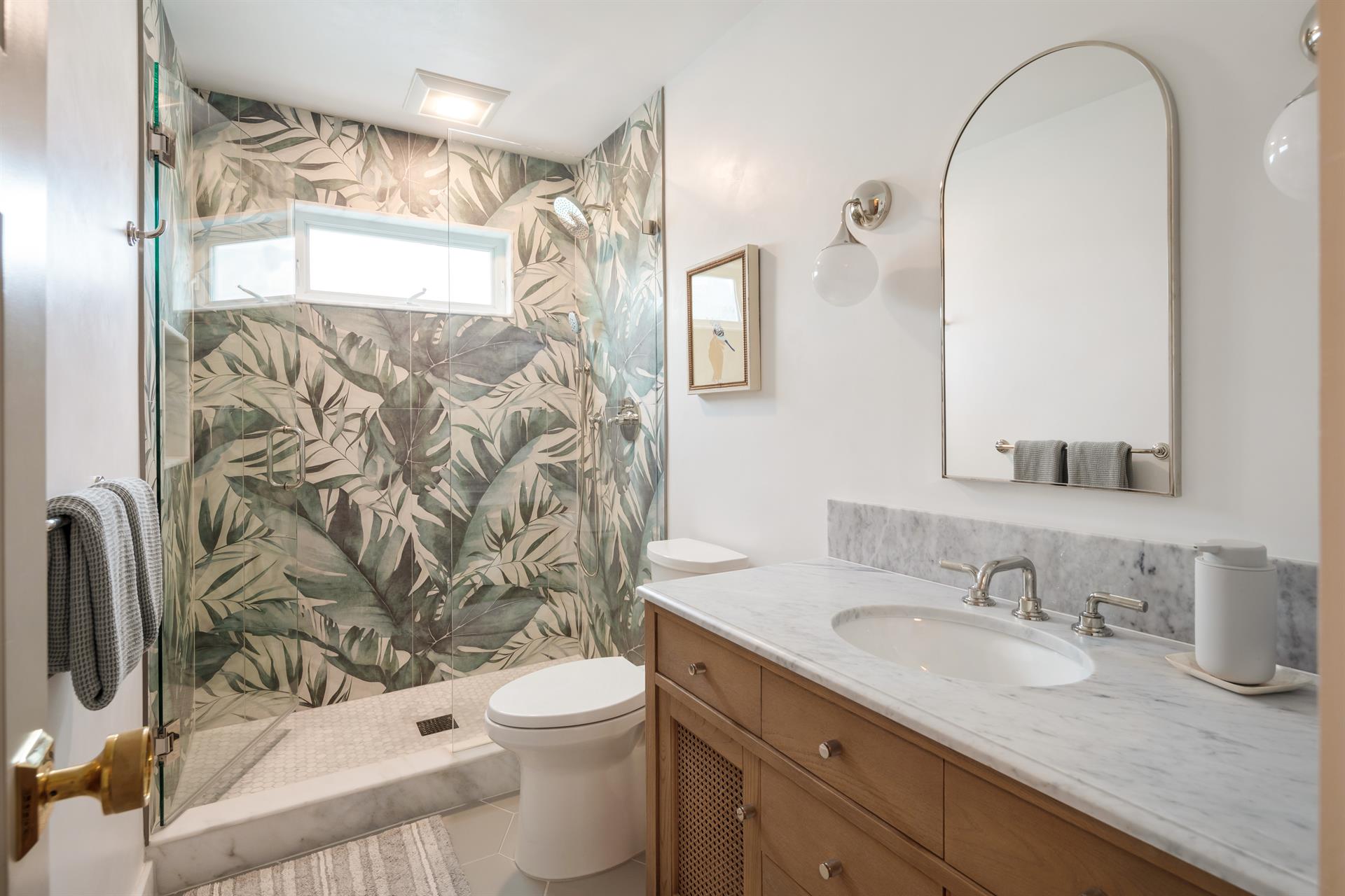 Fabulous hall bath with walkin glass shower.