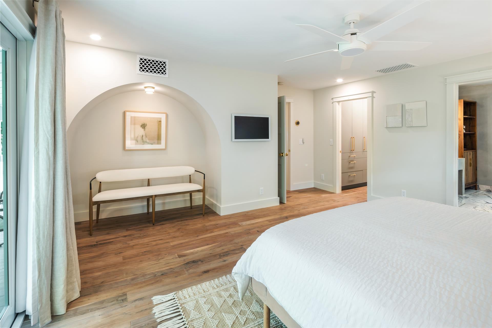 Primary has a luxurious ensuite, walkin closet, and frame TV.