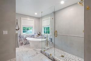 Oversized glass walkin shower with large soaking tub