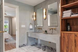 Beautiful custom double sinks in the primary ensuite.