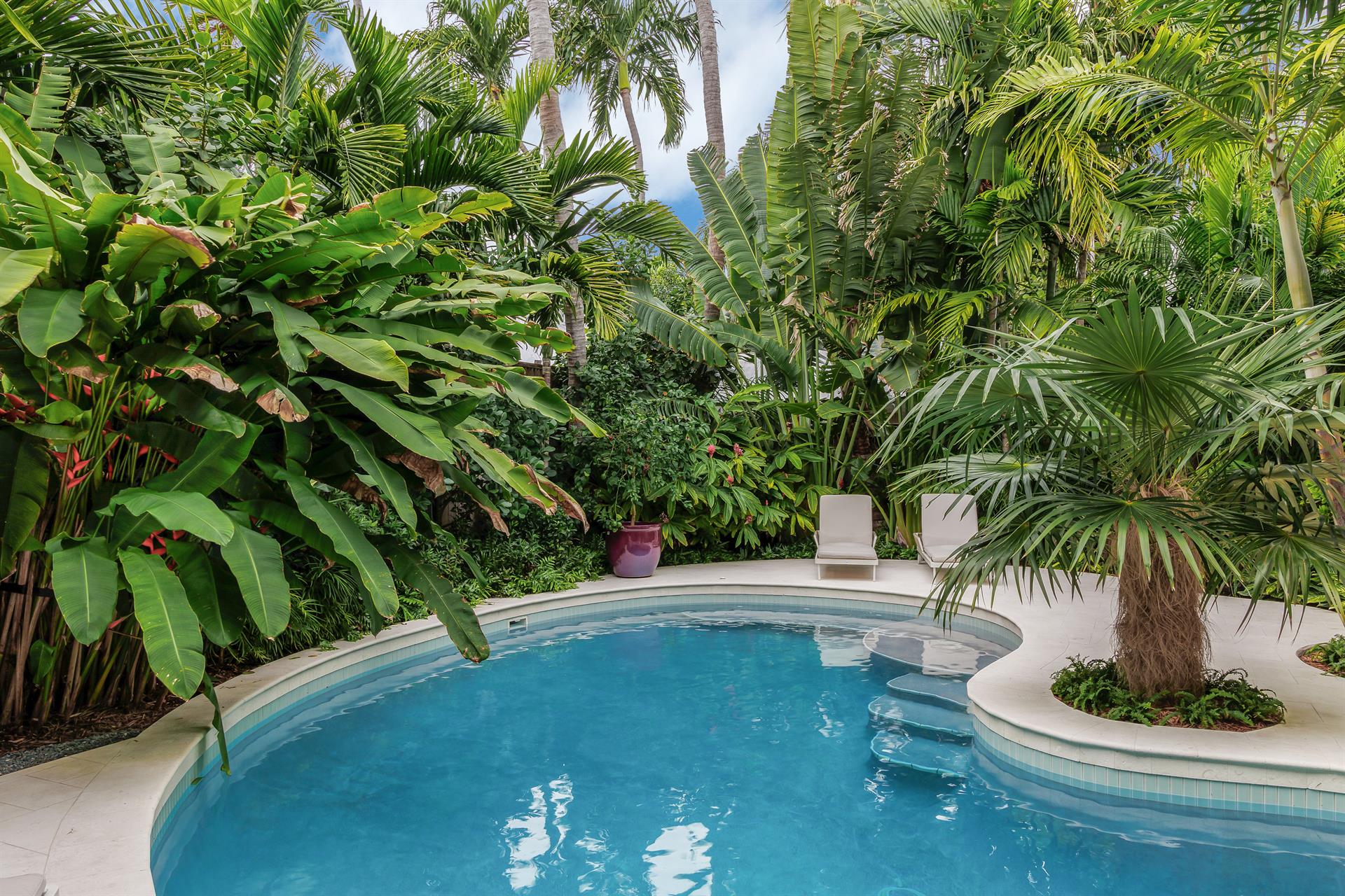 Lush tropical foliage adds to the privacy.