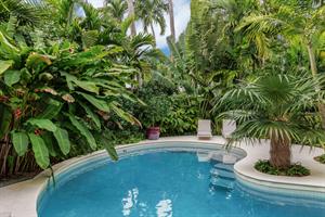 Lush tropical foliage adds to the privacy.