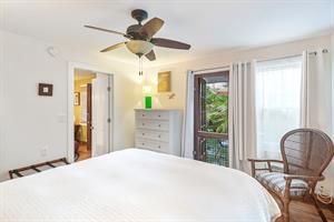 Bedroom has access to lush outdoor area.