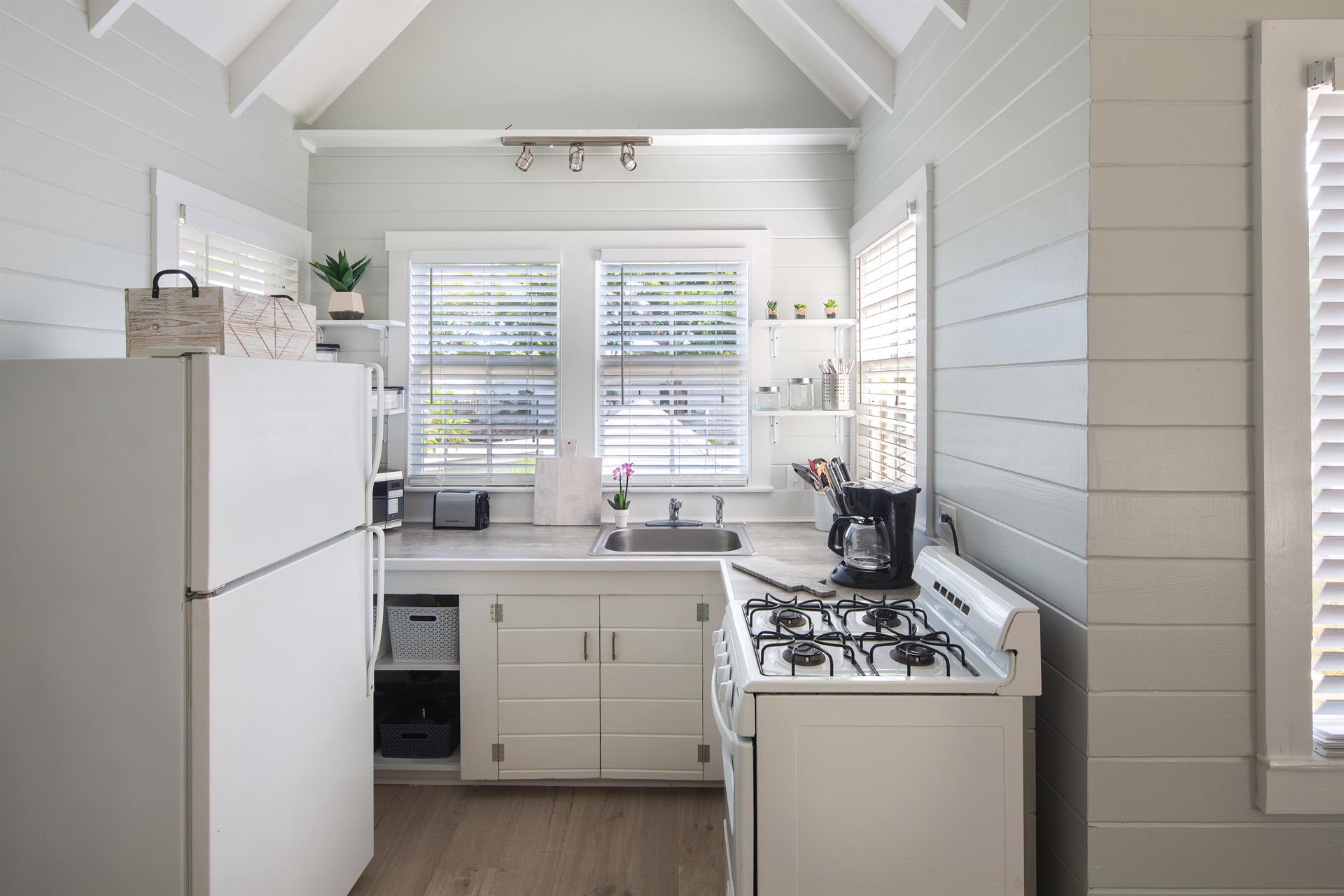 Cute kitchen offers all the amenities of home.