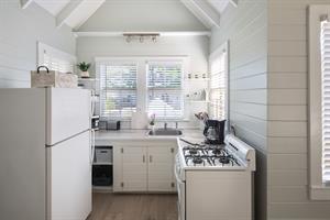 Cute kitchen offers all the amenities of home.