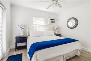 King bedroom has bedside lighting and wall AC