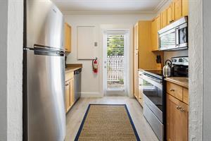 Stainless steel appliances and access to outdoors.