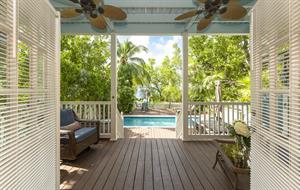 Sweeping doors open wide to the spacious porch.