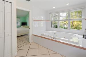 Primary ensuite has a jetted soaking tub.