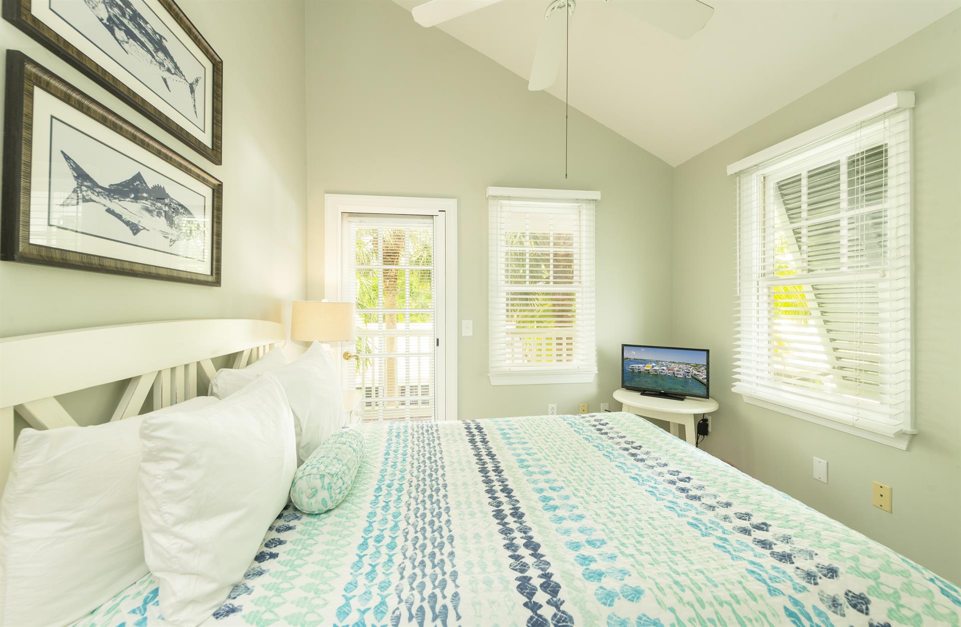 This full bedroom has natural light and front balcony access.
