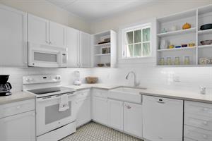 Bright, clean kitchen for meal or snack pep.