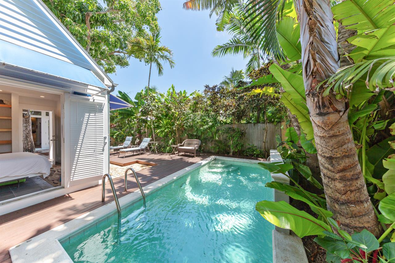 The pool house is steps away from the pristine private pool.