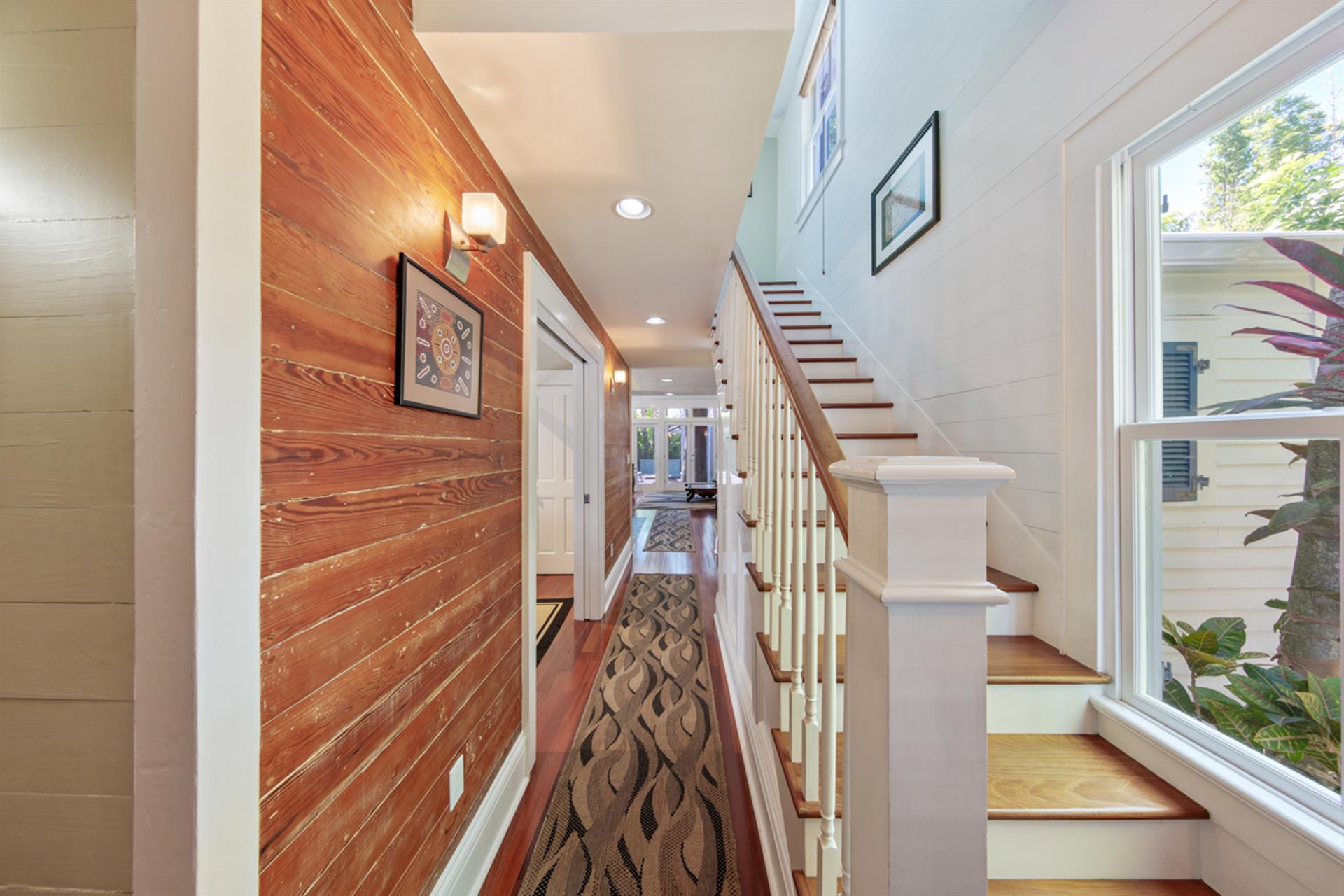 Beautiful hall entry trimmed in Dade County pine.