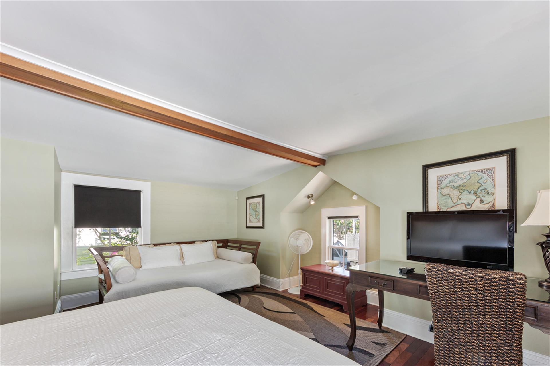 Primary bedroom includes a king bed and a daybed.