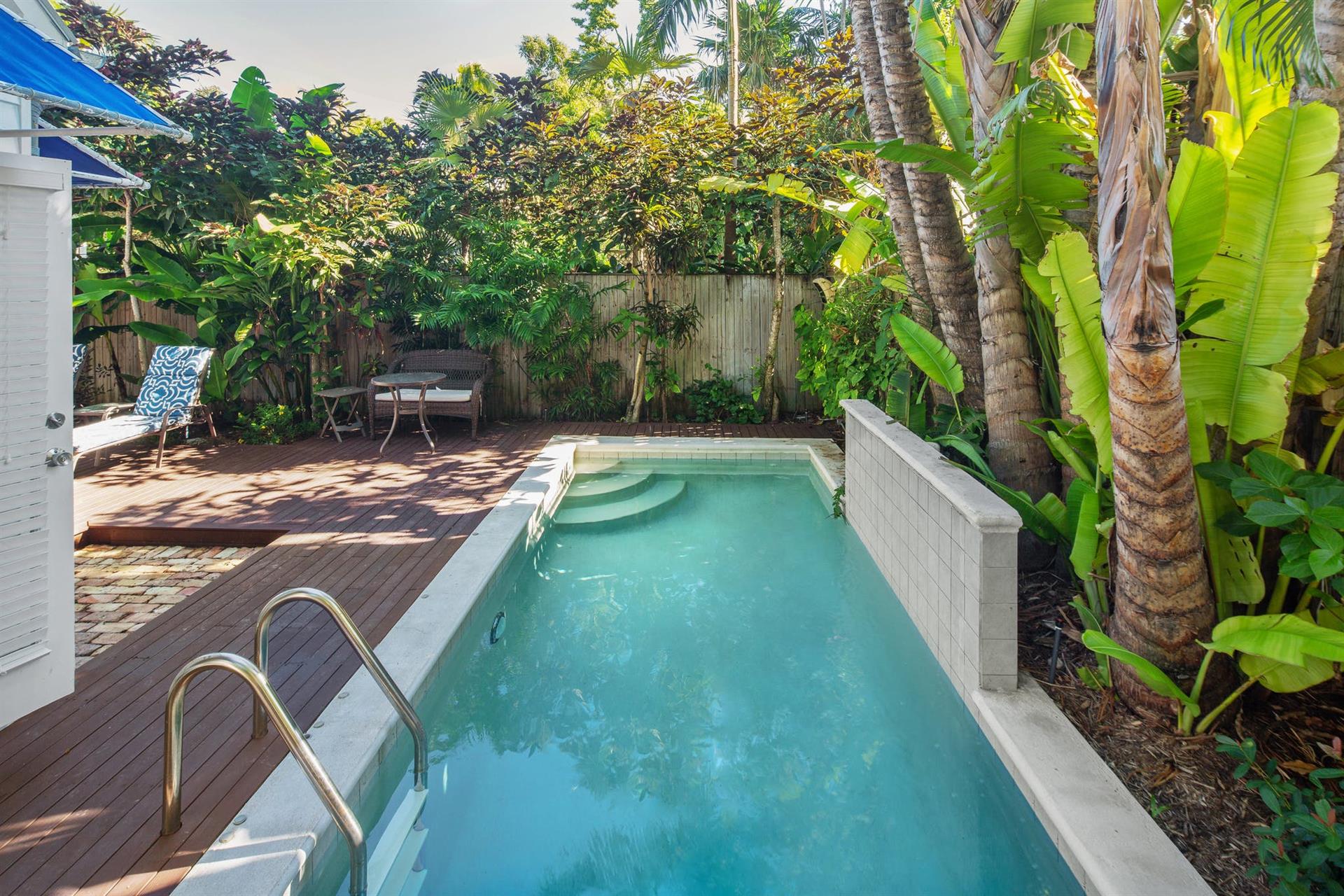 Private pool offers a relaxing waterfall feature.