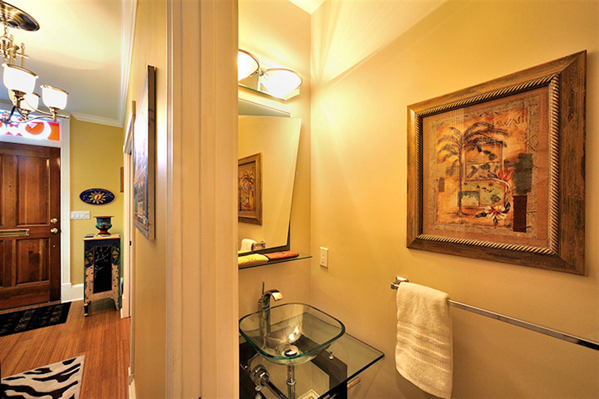 Glass vessel sink in the first floor half bath.