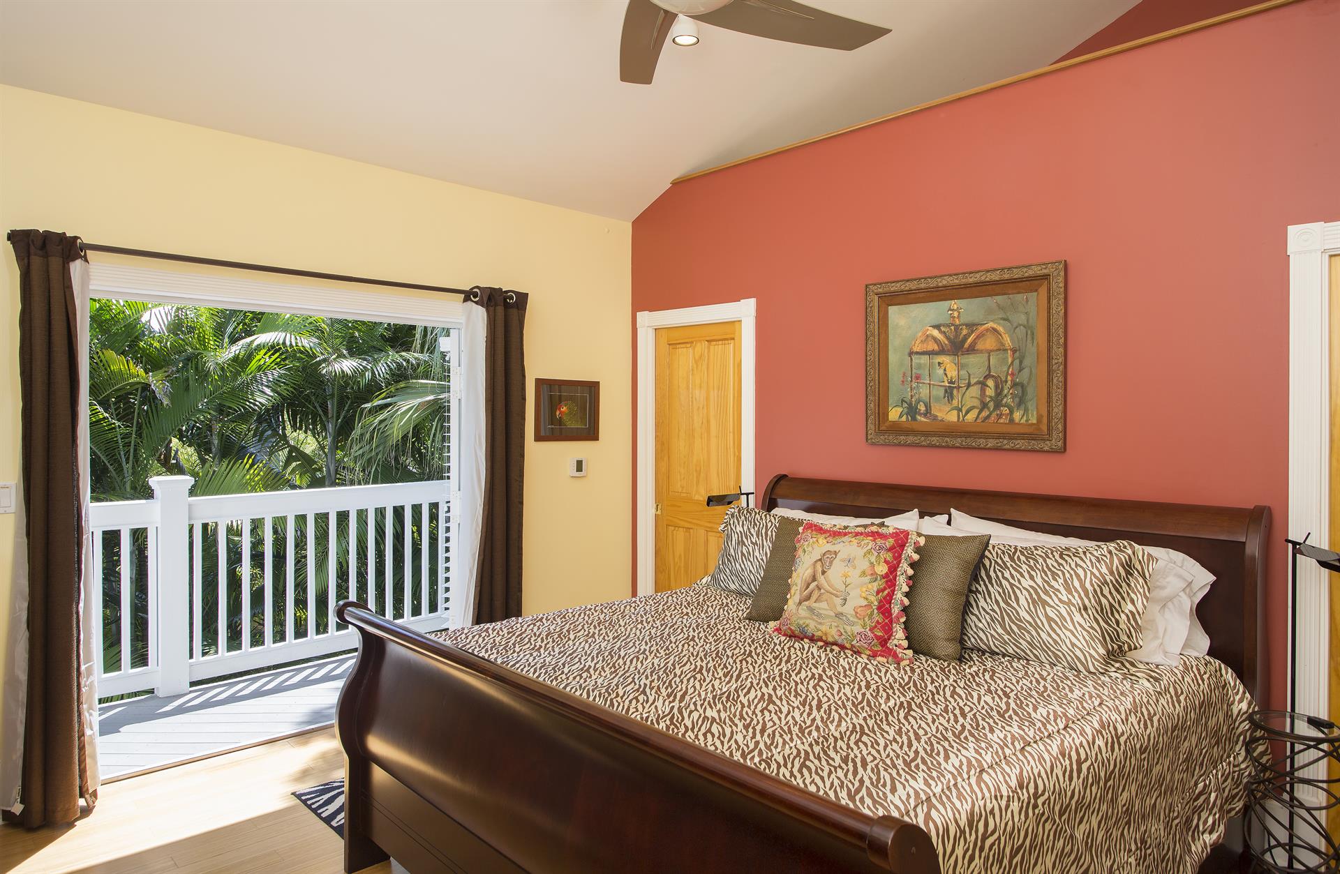 Second floor king bedroom has private balcony overlooking pool