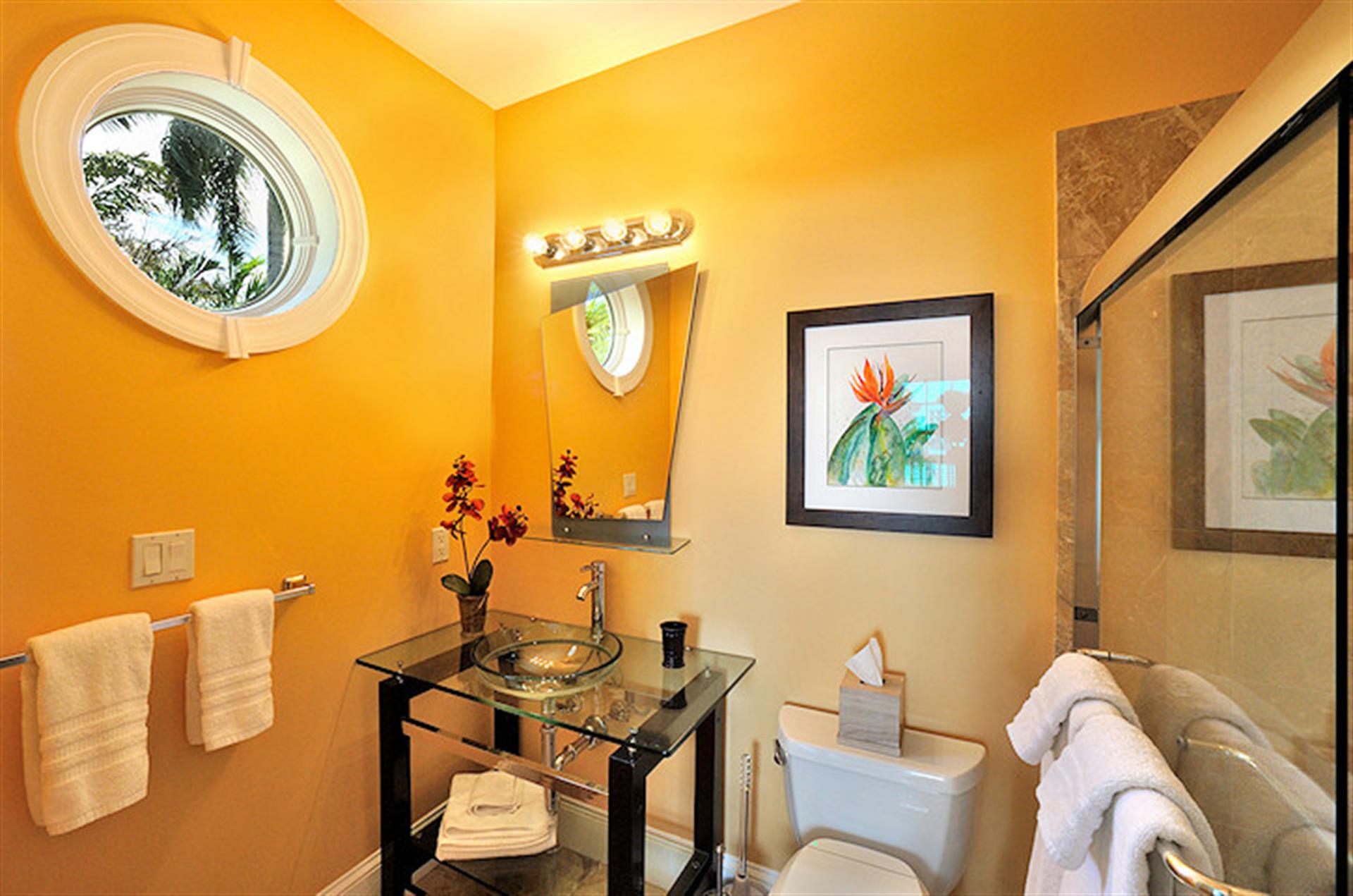 Glass vessel sink in queen en suite bathroom.