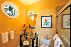 Glass vessel sink in queen en suite bathroom.