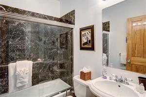 Beautiful hall bath with tubshower combination.