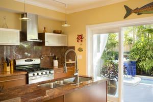 Gourmet kitchen with convenient pool access.